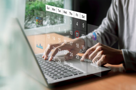 Businessman using mobile smart phone and calendar,Calendar for business planning conceptの写真素材