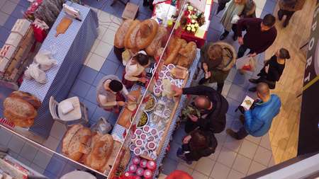 WARSAW, POLAND - DECEMBER, 18, 2016. Top view shot of Christmas bazar booth with traditional bread and cucumber sandwichesのeditorial素材