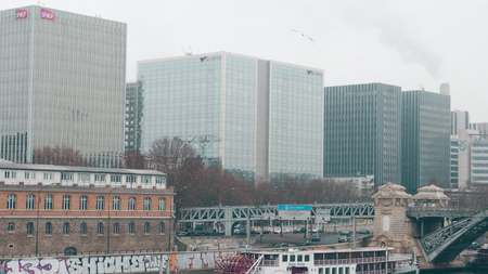 PARIS, FRANCE - DECEMBER, 31, 2016. Modern office buildings on a foggy day. Natixis, SNCF and RATP Group headquarters. River embankmentのeditorial素材