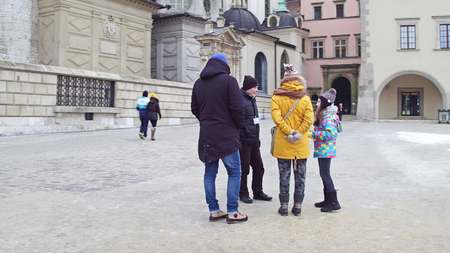 KRAKOW, POLAND - JANUARY, 14, 2017 Guided family group tour at Wawel Castle. Local landmark and popular touristic destinationのeditorial素材