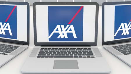Laptops with AXA logo on the screen. Computer technology conceptual editorial 3D renderingのeditorial素材