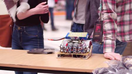 WARSAW, POLAND - MARCH, 4, 2017. DIY robot and young participants of robotics fairのeditorial素材