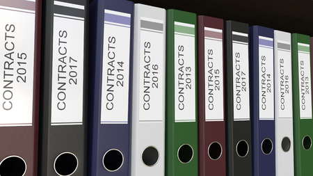 Line of multicolor office binders with Contracts tags different years 3D renderingの写真素材