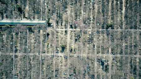 Aerial rising shot of old catholic cemetery on a sunny spring day, top view