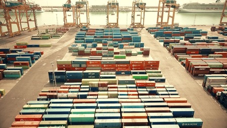 BARCELONA, SPAIN - APRIL, 15, 2017. Aerial shot of harbour cranes and big port container yard