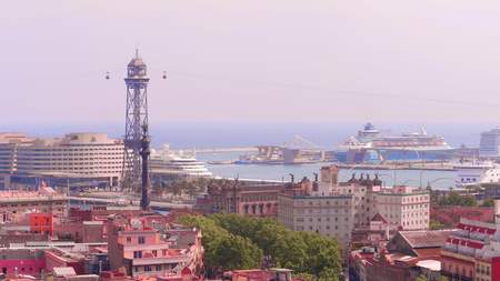 BARCELONA, SPAIN - APRIL, 15, 2017. Port cable car and distant moored cruise linersのeditorial素材