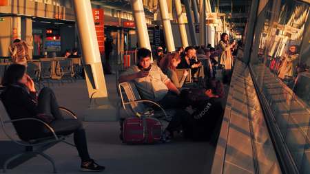 WARSAW, POLAND - APRIL, 14, 2017. Passengers awaiting for the boarding at international airport terminal in the eveningのeditorial素材