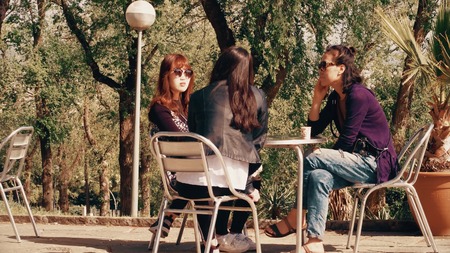 BARCELONA, SPAIN - APRIL, 15, 2017. Three young asian women sit at touristic street cafeのeditorial素材