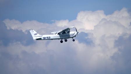 WARSAW, POLAND - MAY, 13, 2017. Telephoto lens shot of SP-KLP Cessna 172S Skyhawk propeller airplane...
