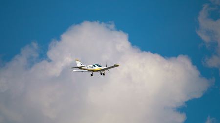 WARSAW, POLAND - MAY, 13, 2017. Telephoto lens pan shot of Czech Sport Aircraft PS-28 Cruiser flying in the skyのeditorial素材