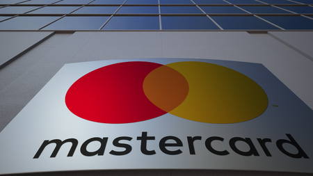 Outdoor signage board with MasterCard logo. Modern office building. Editorial 3Dのeditorial素材