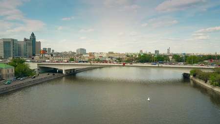 MOSCOW, RUSSIA - MAY, 24, 2017. Low altitude aerial shot of a river within industrial area and a car bridgeのeditorial素材