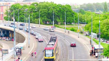 WARSAW, POLAND - JUNE 10, 2017. Road traffic near tram stopのeditorial素材