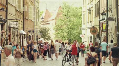 WARSAW, POLAND - JUNE 10, 2017. Tourists walk along old town street on a summer sunny dayのeditorial素材