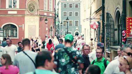 WARSAW, POLAND - JUNE 10, 2017. People walk along old town street on a summer sunny dayのeditorial素材