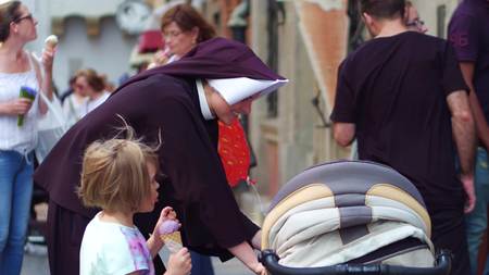 WARSAW, POLAND - JUNE 10, 2017. Nun and small kids on the street