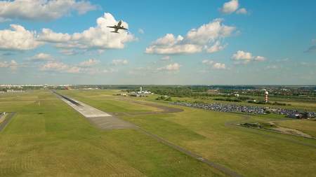 WARSAW, POLAND - JUNE 19, 2017. Aerial shot of LOT commercial airliner taking off and leaving Chopin...