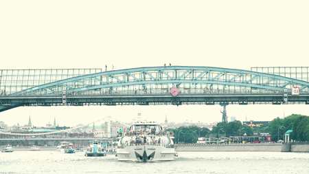 MOSCOW, RUSSIA - JUNE 29, 2017. Young people having fun climbing up on the bridge archs dangerously and illegallyのeditorial素材