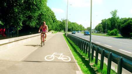 WARSAW, POLAND - JULY 11, 2017. Bike path aside wide car roadのeditorial素材