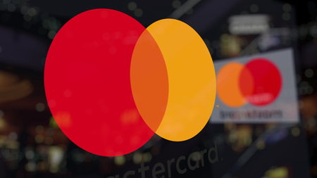 MasterCard logo on the glass against blurred business center. Editorial 3D renderingのeditorial素材