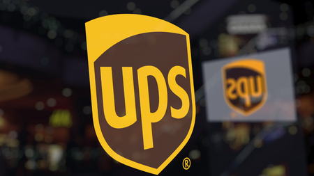 United Parcel Service UPS logo on the glass against blurred business center. Editorial 3D renderingのeditorial素材