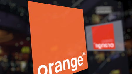 Orange S.A. logo on the glass against blurred business center. Editorial 3D renderingのeditorial素材