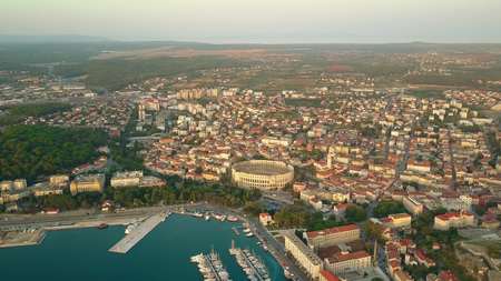 Aerial shot of the ancient city of Pula involving famous Roman amphitheatreの写真素材