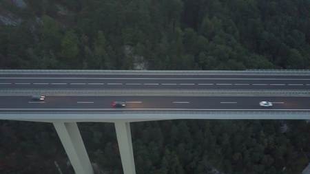 Aerial view of European highway bridge in mountains at duskの写真素材