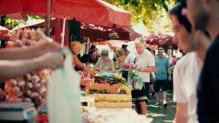 PULA, CROATIA - AUGUST 4, 2017. People buying fresh vegetables at local marketplaceのeditorial素材