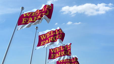 Waving flags with Wells Fargo logo against sky, editorial 3D renderingのeditorial素材