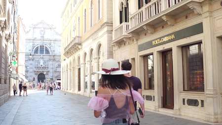 VENICE, ITALY - AUGUST 8, 2017. Luxury Dolce and Gabbana and Cucci fashion stores located in ancient buildingsのeditorial素材