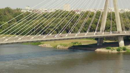 Aerial shot of the modern guyed bridge over the Vistula river in Warsaw, Poland