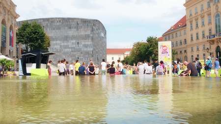 VIENNA, AUSTRIA - AUGUST 12, 2017. Young people attending group fitness class at the Museums Quartier areaのeditorial素材