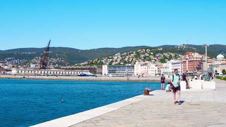 TRIESTE, ITALY - AUGUST 11, 2017. Pier, seaport and city pan viewのeditorial素材