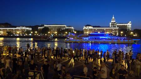 RUSSIA, MOSCOW - AUGUST 18, 2017. People dancing on Gorky park river embankment in the eveningのeditorial素材