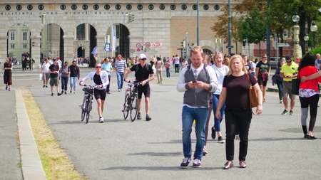 VIENNA, AUSTRIA - AUGUST 12, 2017. People walk along city street on a sunny dayのeditorial素材