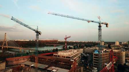 WARSAW, POLAND - SEPTEMBER 27, 2017. Aerial view shot of tower cranes at urban construction siteのeditorial素材
