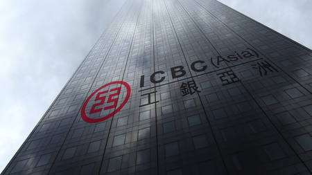 Industrial and Commercial Bank of China ICBC logo on a skyscraper facade reflecting clouds....