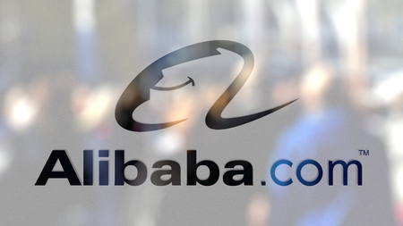 Alibaba.com logo on a glass against blurred crowd on the steet. Editorial 3D renderingのeditorial素材