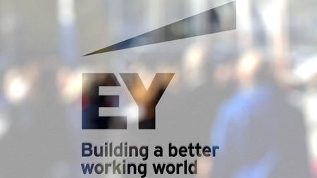 Ernst & Young logo on a glass against blurred crowd on the steet. Editorial 3D renderingのeditorial素材