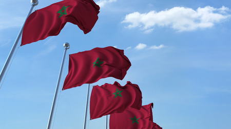 Multiple waving flags of Morocco against the blue sky. 3D rendering