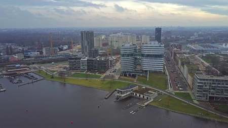 AMSTERDAM, NETHERLANDS - DECEMBER 29, 2017. Aerial view of De Omval district, the Amstel river and Spaklerweg metro stationのeditorial素材