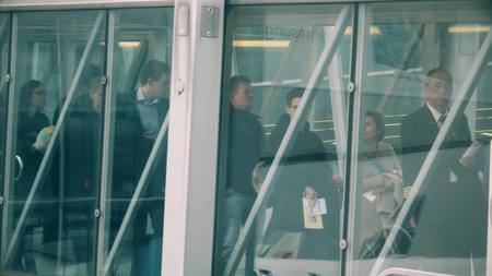 AMSTERDAM, NETHERLANDS - DECEMBER 25, 2017. People boading an airplane via glass jet bridge at the Schiphol international airportのeditorial素材