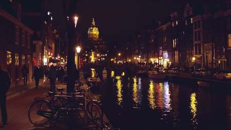 City canal at night in Amsterdamの写真素材