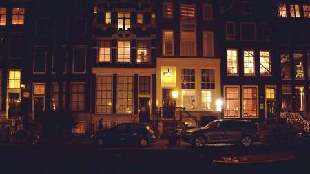 AMSTERDAM, NETHERLANDS - DECEMBER 27, 2017. City canal and traditional facades of housesのeditorial素材