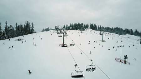 BIALKA TATRZANSKA, POLAND - FEBRUARY 3, 2018. Aerial view of an alpine ski lifts and mountain slopeのeditorial素材
