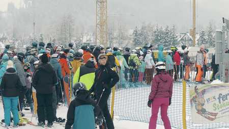 BIALKA TATRZANSKA, POLAND - FEBRUARY 4, 2018. Crowded alpine ski slope, the queue to chairliftのeditorial素材