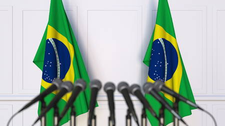 Brazilian official press conference. Flags of Brazil and microphones. Conceptual 3D renderingの写真素材