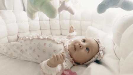 Adorable newborn baby girl in her cotの写真素材
