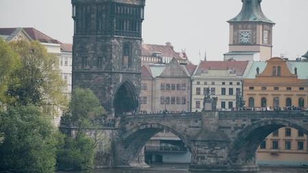 Crowded Charles bridge across the Vltava river in Prague, the Czech Republicの写真素材